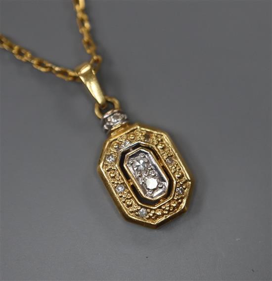 A modern yellow metal (stamped 750) and diamond set pendant, 13mm, on an unmarked yellow metal chain, gross 5.5 grams.